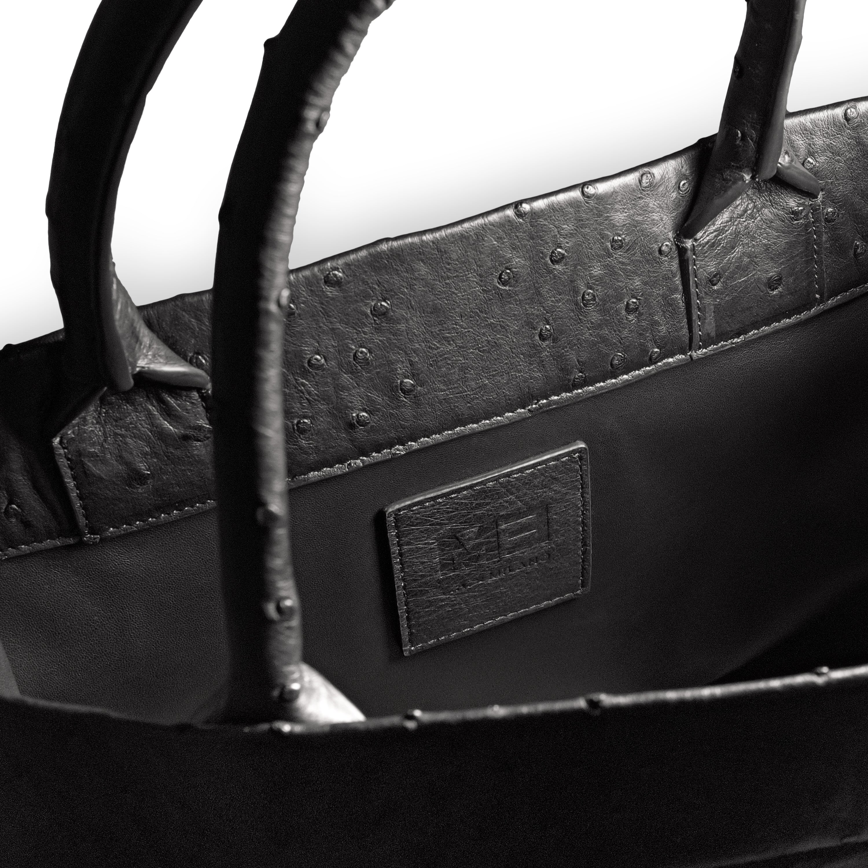 Luxury ostrich leather tote black - side view with calf leather lining
